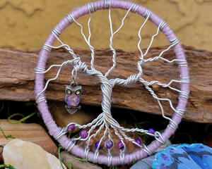 close up front view purple tree of life created with aluminum wire